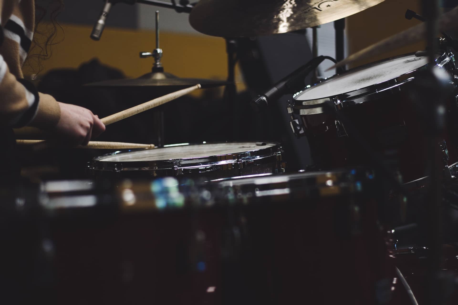 Photo of a drum kit being played.