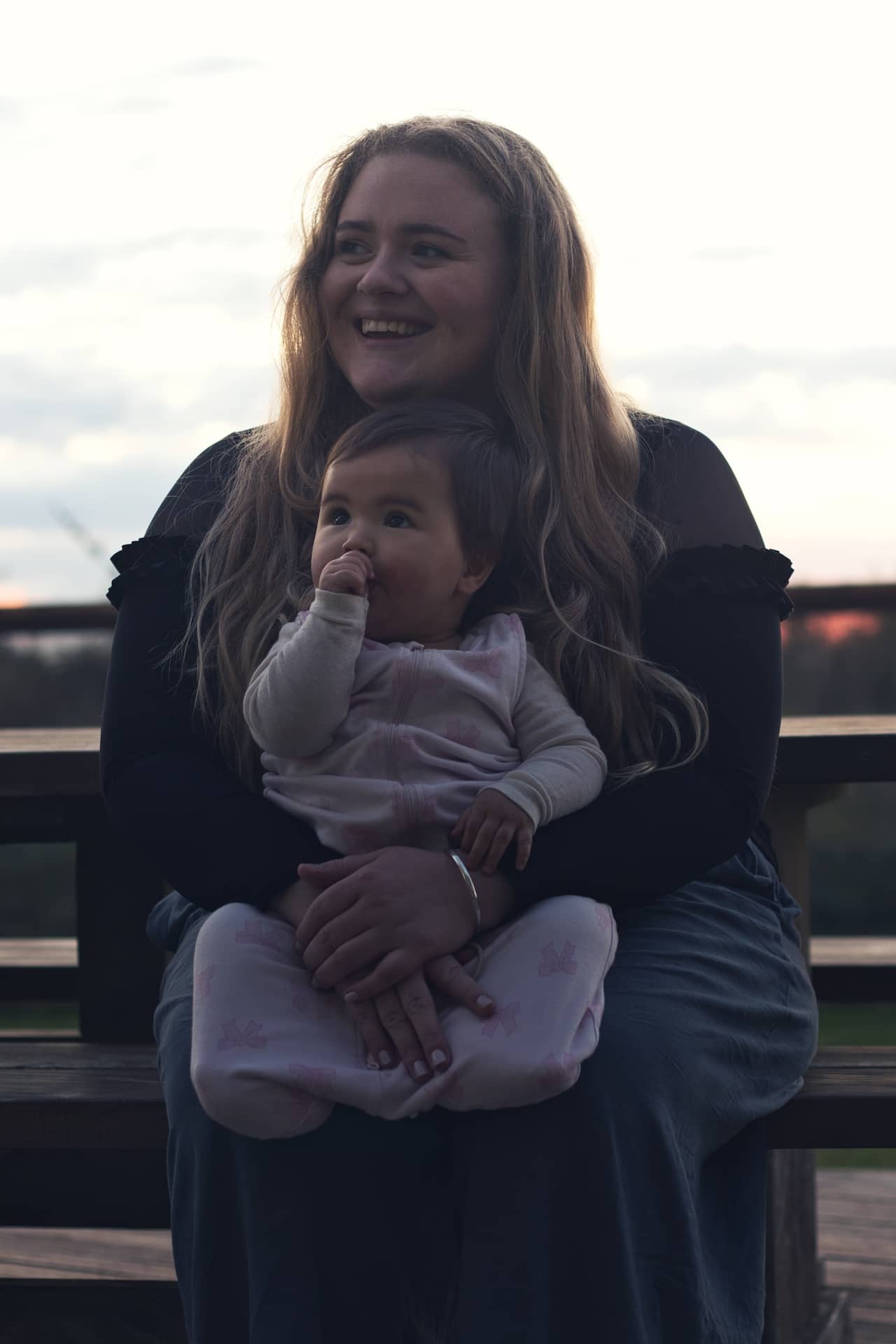 Photo of a mother holding her little baby daughter.