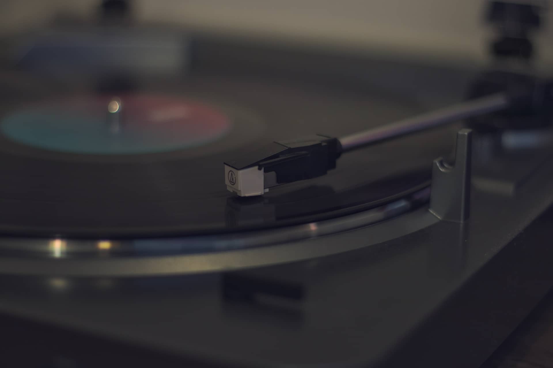 Close-up photo of a vinyl on a record player.