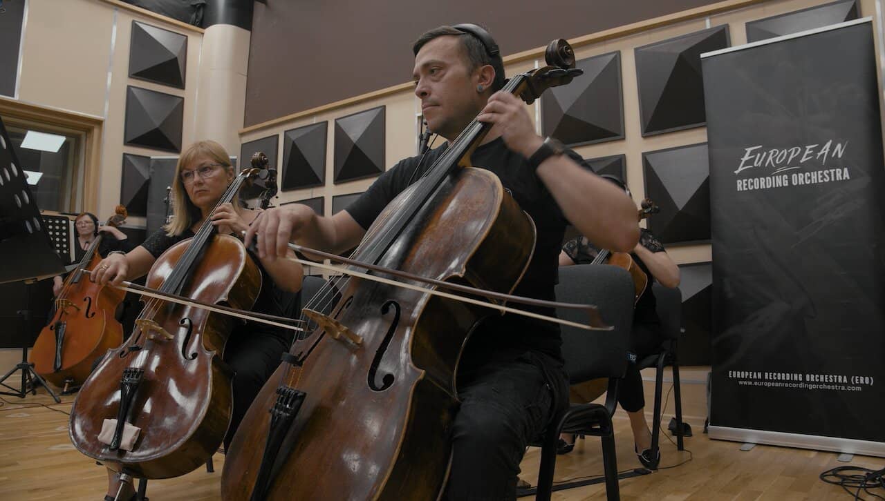 A thumbnail showing a still taken from the music video for Per Ardua Ad Astra, featuring the musicians of the European Recording Orchestra.
